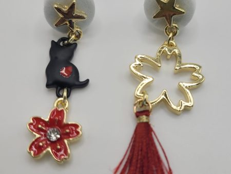 Pendientes de bisutería gatito negro y estrella dorada Sale